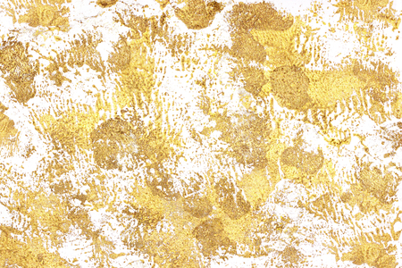 the golden paint is smeared with smearsの写真素材