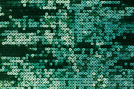 Sparkling green sequin textile backgroundの写真素材