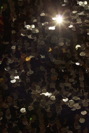 Black with gold iridescent and shiny sequins.の写真素材