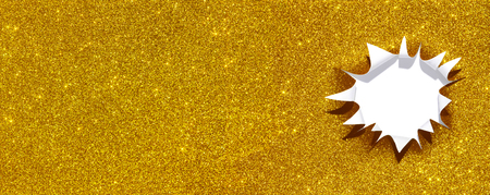 shiny golden paper with a ragged hole that looks like a starの写真素材