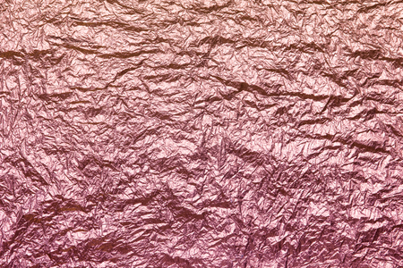 crumpled good-looking foil as background texture on holiday banners pink, red, purple dark and lightの写真素材