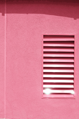 pink wall with a shadow from a canopy cement wall texture backgroun. Wall with blindsの写真素材