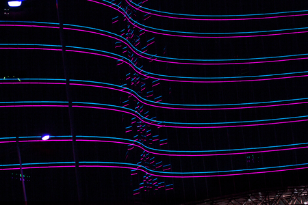 red, blue neon lights of the building. Building with neon lights in the nightの写真素材