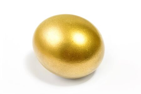 Close-up top view of golden Easter egg isolated on white background, Happy Easter conceptの写真素材