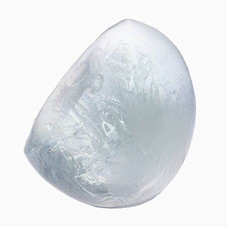 a piece of ice is bluish-grayish, uneven structure, macroの写真素材