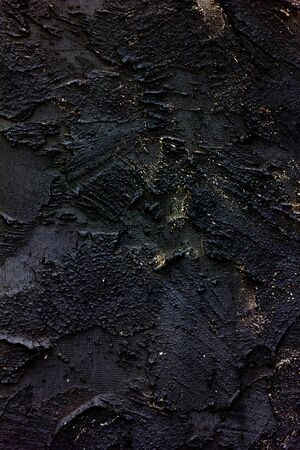 abstract black texture, vintage old background, black decorative stucco with a splash of goldの写真素材