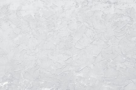 white old wall, cracked concrete background, white decorative plasterの写真素材