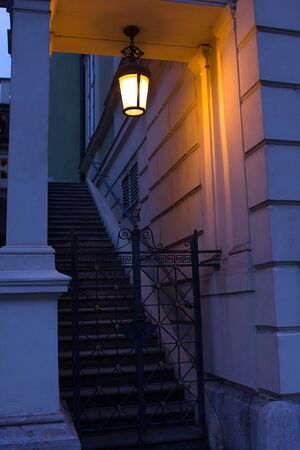 Antique gas lanterns adorn with fabulous light the night city of Europe.の写真素材