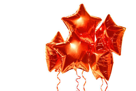 Set of red foil balloons on white backgroundの写真素材