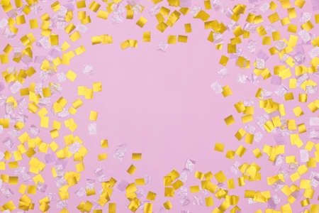 gold square sequins on pink backgroundの写真素材