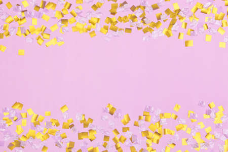 gold square sequins on pink backgroundの写真素材