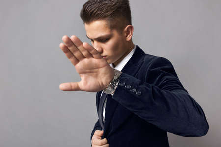 man with the emotion of denial, shows his palm, sign of denialの写真素材