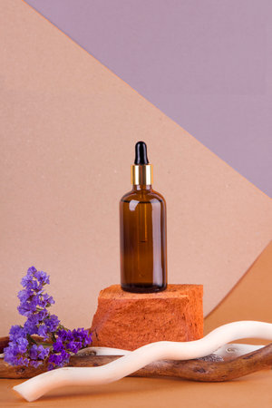 cosmetics with pipette, dispenser in the design of wood and flowersの写真素材