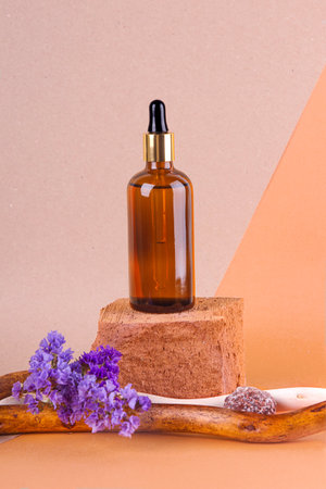 cosmetics with pipette, dispenser in the design of wood and flowersの写真素材