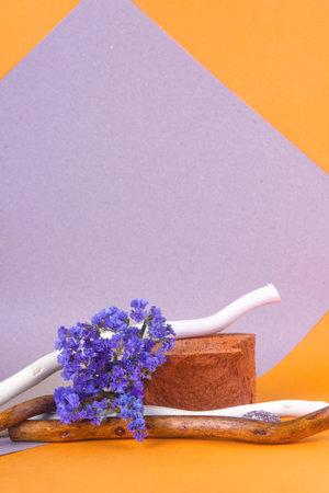 Red brick podium for advertising cosmetic products. yellow-pink background. Wabi sabi concept.の写真素材