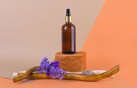 cosmetics with pipette, dispenser in the design of wood and flowersの写真素材