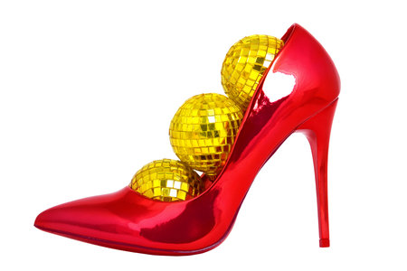 Red lacquer shoe with New Year's yellow balls. Christmas clearance sale concept. concept of the Christmas holiday.の写真素材