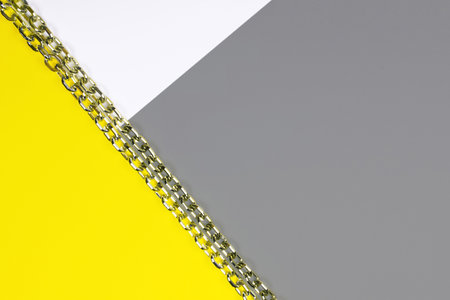 Abstract geometric background. Sheets of colored paper illuminating, yellow, ultimate, gray. Color 2021.の写真素材