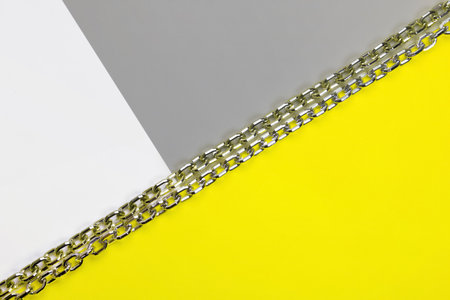 Abstract geometric background. Sheets of colored paper illuminating, yellow, ultimate, gray. Color 2021.の写真素材