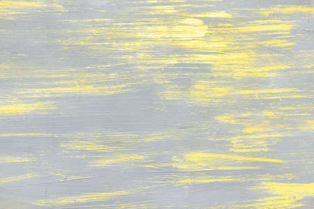 yellow paint strokes on on gray backgroundの写真素材