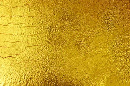 texture of golden background. Cracked texture painted in goldの写真素材