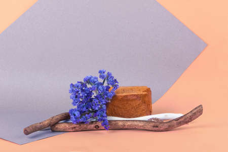 stone podium for a bottle or jar with cosmetics, cosmetics on a brick podium on a pastel background.の写真素材
