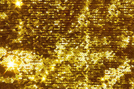 Gold glittering sequins sequins scales, great background for your designの写真素材