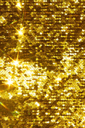 Gold glittering sequins sequins scales, great background for your designの写真素材
