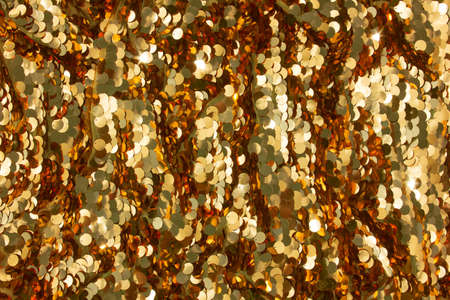 Bright golden round sequins background, backdrop for your advertisingの写真素材