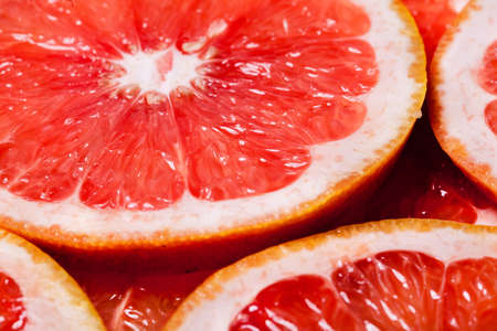 Orange slices.Red orange cut background close-upの写真素材