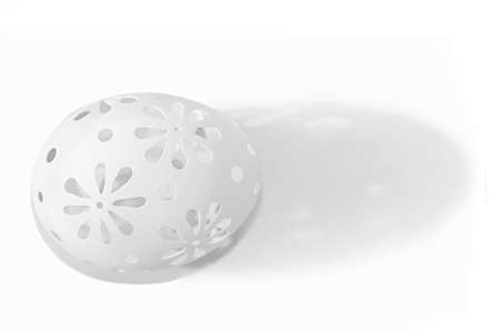 Chicken Easter egg with carving. Macro. Isolated on a white background. Your background for design.の写真素材
