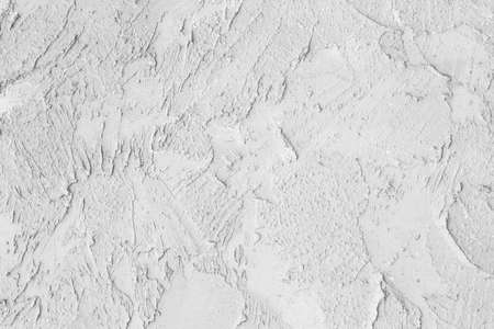 white plastered wall, cracked concrete background, white decorative plasterの写真素材