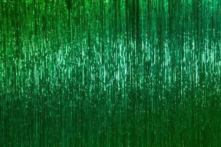 Green Christmas tinsel, festive emerald background. Christmas background.の写真素材