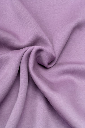 dense warm draped pink jersey for winter backgroundの写真素材