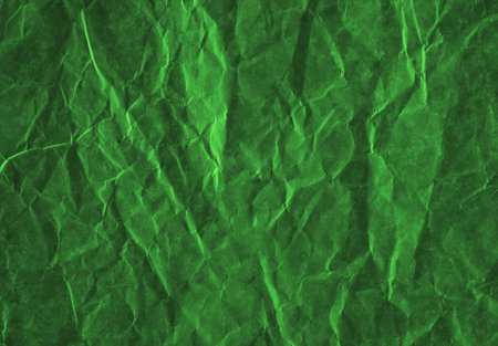 Dark green crumpled paper, perfect background for design.の写真素材