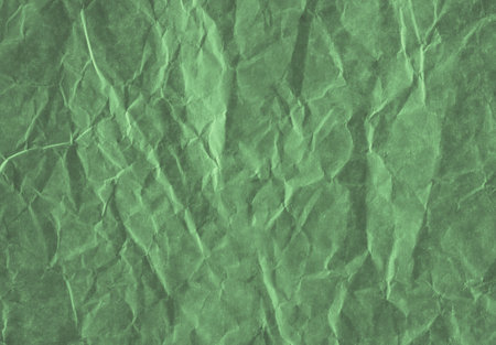 Light green crumpled paper, perfect background for design.の写真素材