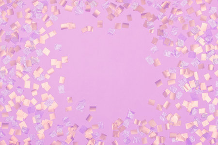 gold square sequins on pink backgroundの写真素材