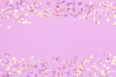gold square sequins on pink backgroundの写真素材