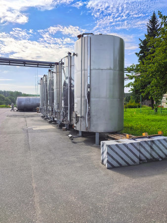 Stainless steel ethanol storage tanks. Ground storage. Industrial factory territory.の写真素材