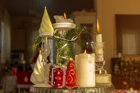 Christmas home decor, burning candles and fir branches, New Year's card.の写真素材