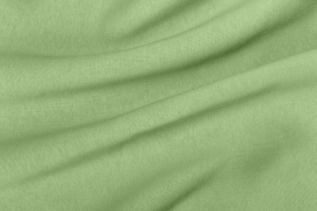 Thick warm draped green jersey for winter background.The concept of sport, convenience and unisex.の写真素材