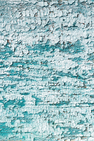 Cracked blue paint on a wooden board, craquelure, unique natural, natural, vintage background.の写真素材