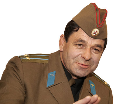 Isolated portrait on a white background of an officer lieutenant colonel of the Soviet army in a soldier's cap, humor, emotion.の写真素材
