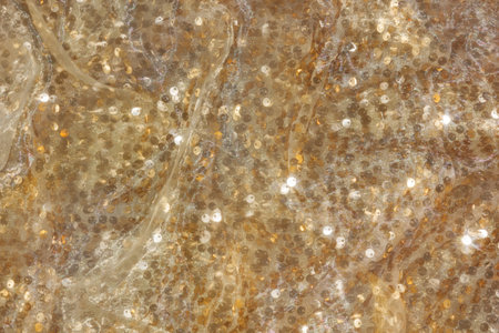 Gold sequin background with white silk folds on top. For your design for Christmas or special day.の写真素材