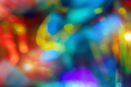 Bright blurred neon red orange blue purple rainbow gradient background. Spotted bright rainbow holographic abstract background.の写真素材