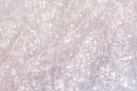Shiny pearlescent festive background with sequins. Space for text.の写真素材