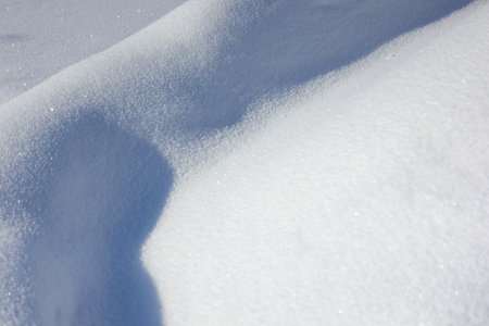 Big white snowdrift background. Winter snow background. A big snow drift.の写真素材