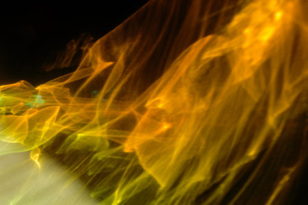 Abstract glowing background. Yellow cosmic smoke. God's rays. Universe explosion.の写真素材