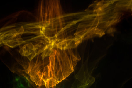 Abstract glowing background. Yellow cosmic smoke. God's rays. Universe explosion.の写真素材