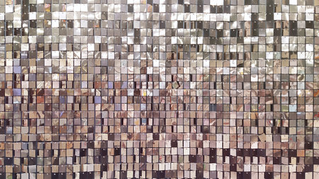 Decorative wall with ornament of shiny mirror silver squares. Square mirror tiles background.の写真素材